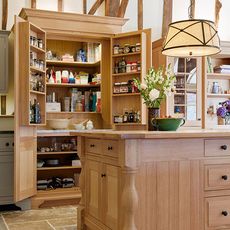 kitchen area with wooden furniture and cabinet