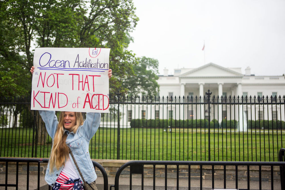 Gabrielle Walters, 21, poses for photographs in front of The White House before heading to the National Mall.