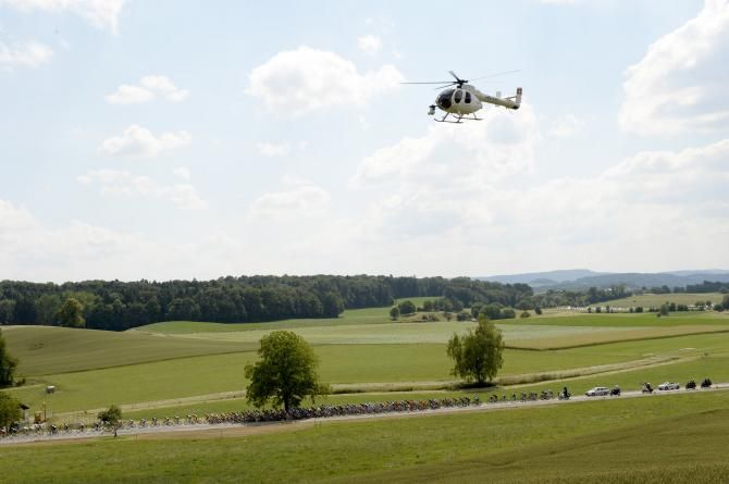 The TV helicopter watches over the peloton