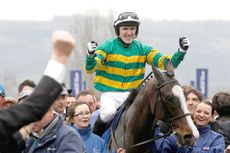 2CP4DDD AP on Synchronised celebrates as he enters the unsaddling enclosure after winning The Gold Cup at the Cheltenham Festival horse racing meet in Gloucestershire, western England March 16, 2012. REUTERS/Stefan Wermuth (BRITAIN - Tags: SPORT HORSE RACING)