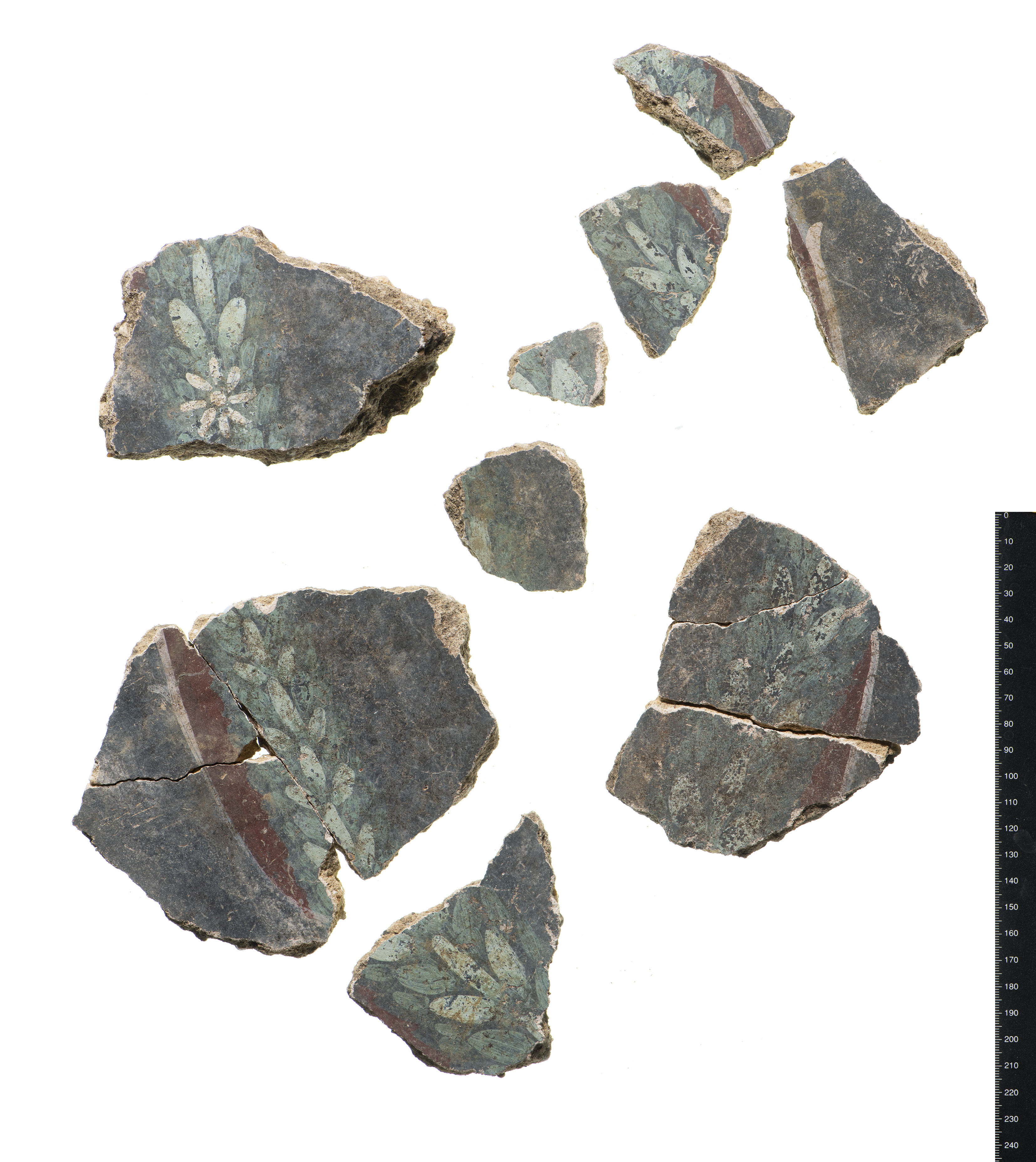 Nine fragments of a fresco are aligned to reveal a faded floral pattern.