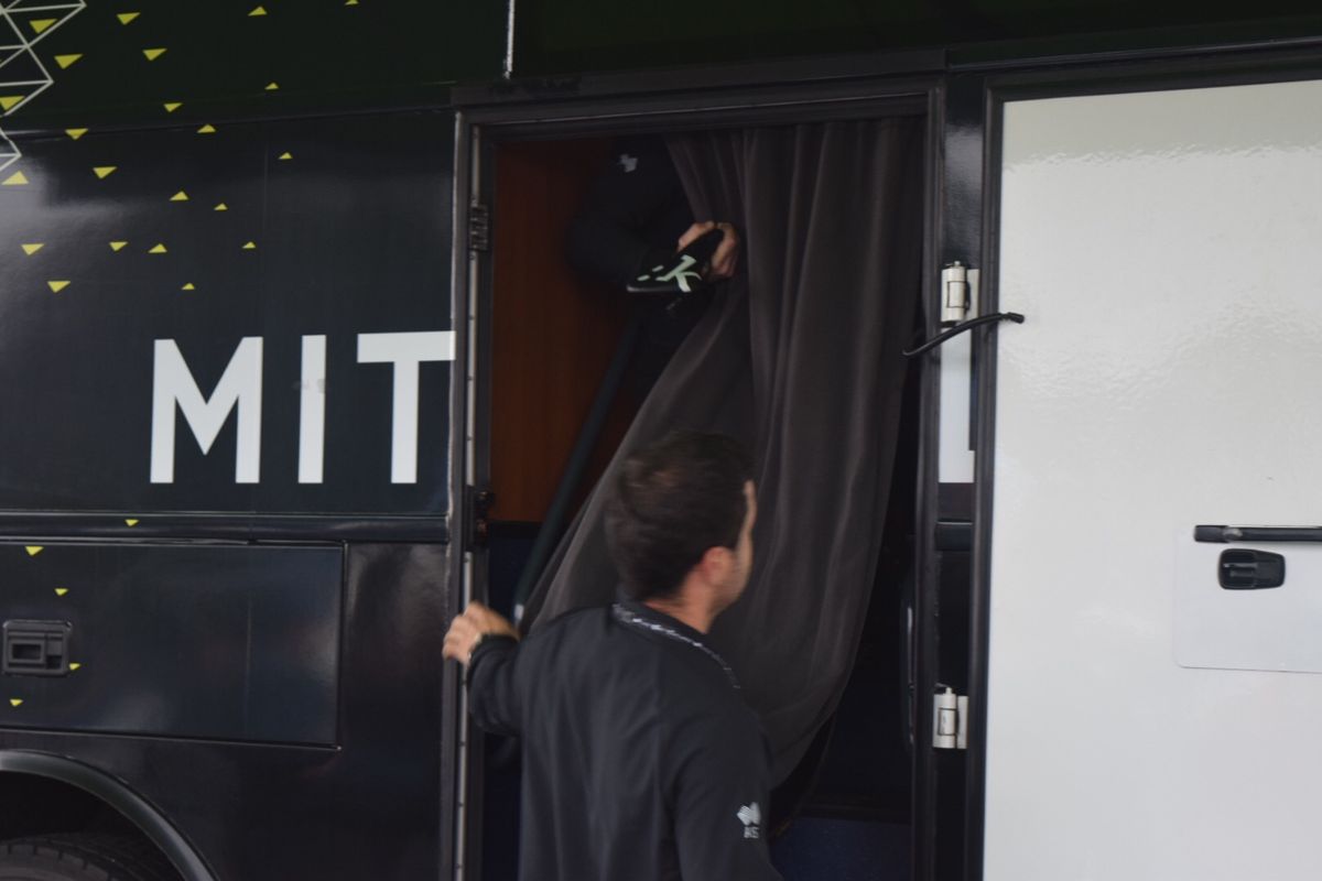 Rohan Dennis's time trial bike is lifted onto the Australian team bus