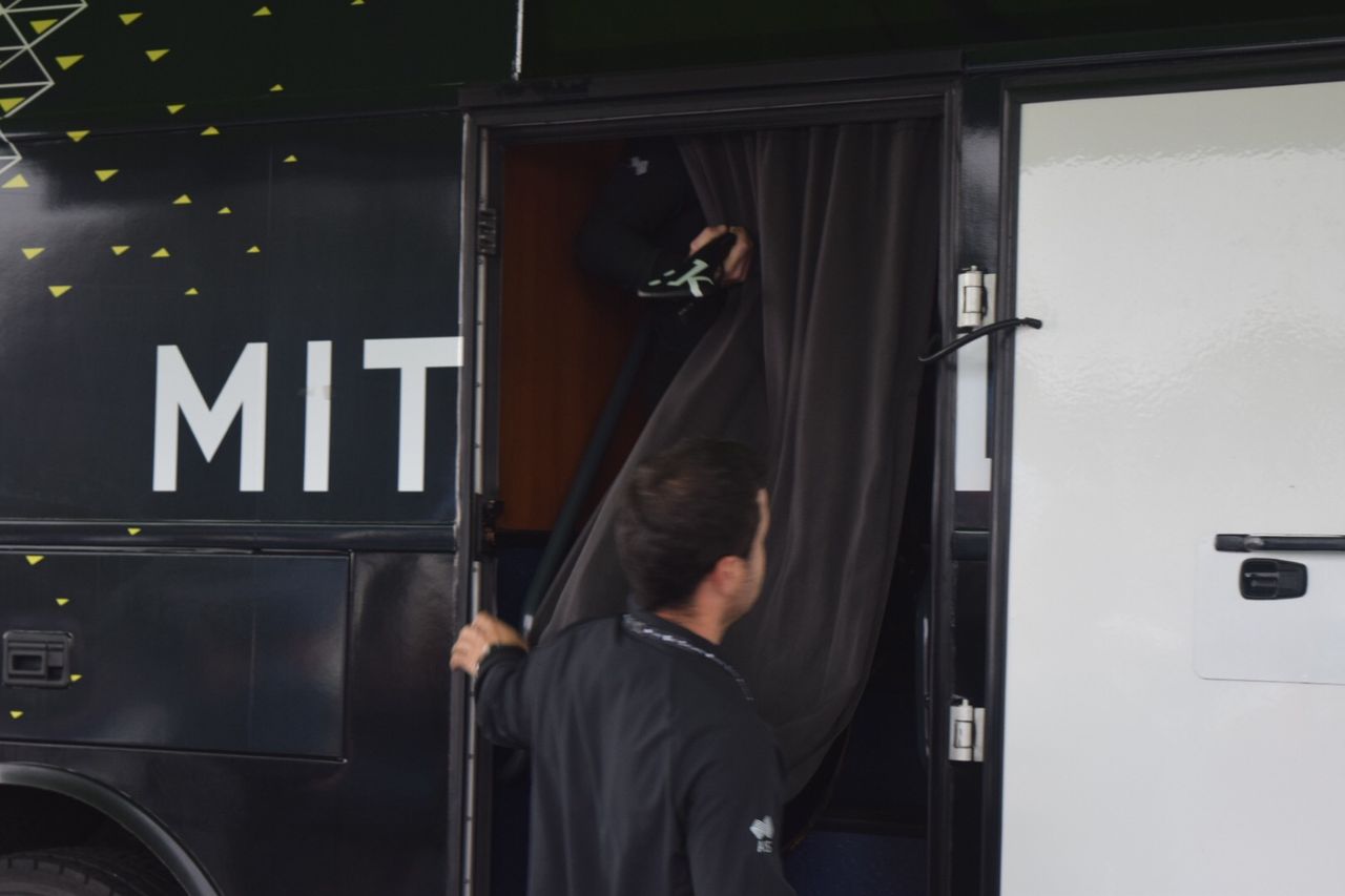 Rohan Dennis's time trial bike is lifted onto the Australian team bus
