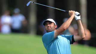 Scottie Scheffler hits his second shot on the 9th hole during the third round of the PGA Championship