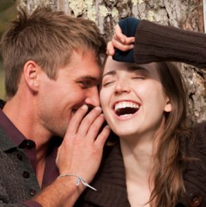 man and woman laughing