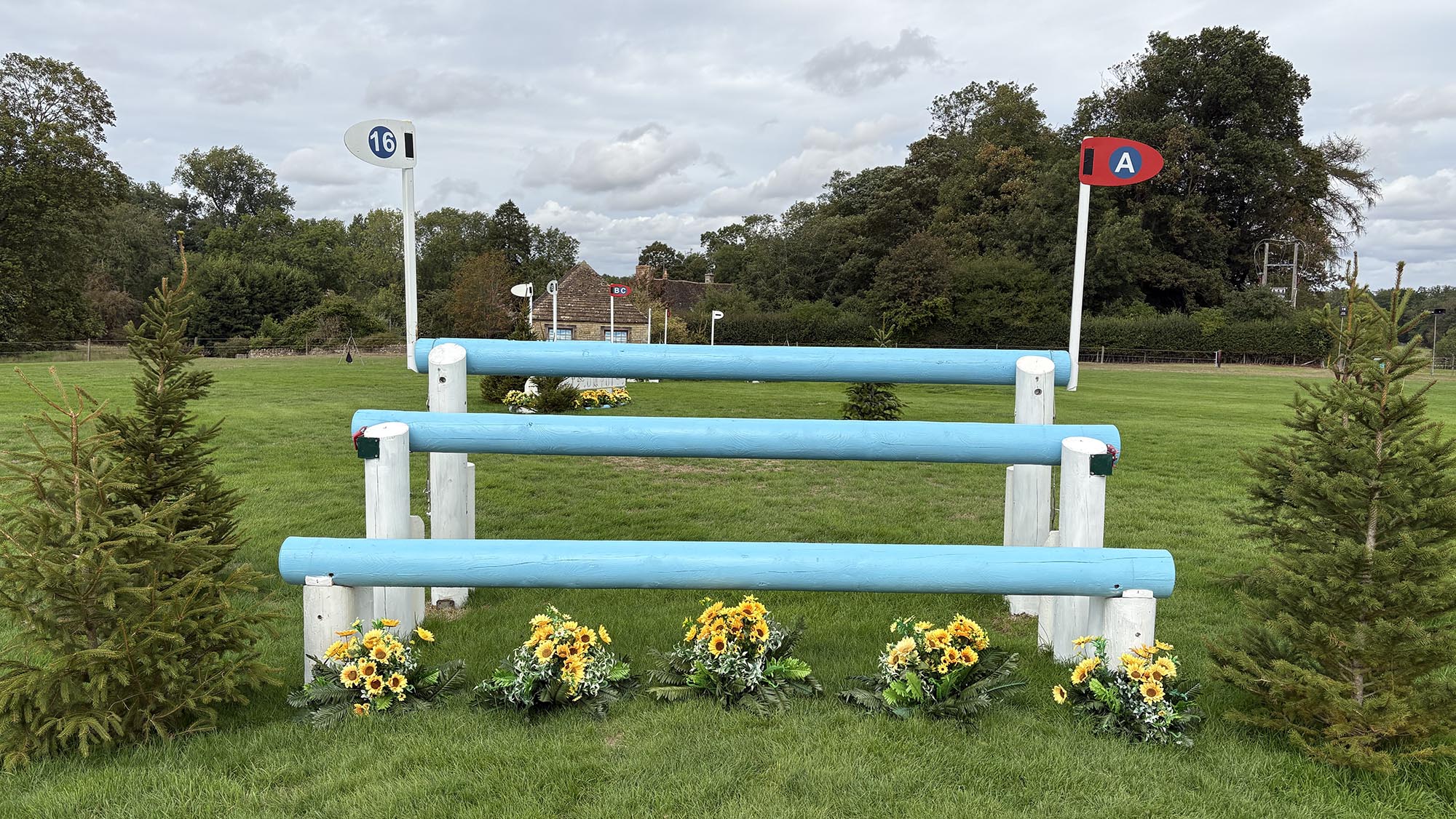 Blue triple bar fence on the Burghley cross-country course 2026