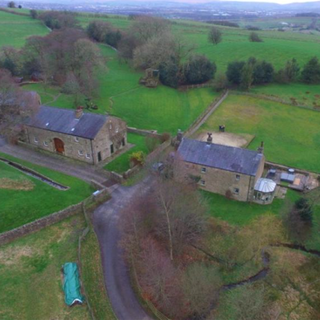 aerial view of house and garden and road