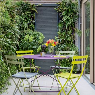 Patio area with living wall and bistro set