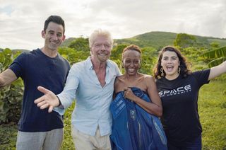 From left, Omaze CEO and co-founder Matt Pohlson, Virgin Group founder Richard Branson, Omaze winner Keisha S., and Space for Humanity Executive Director Rachel Lyons congratulate Keisha at her home in Antigua.