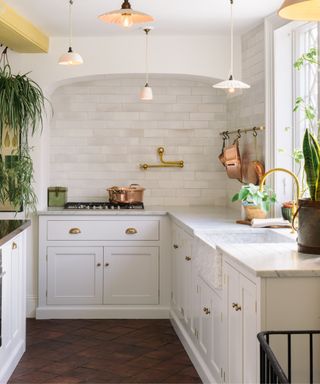 White kitchen with dark wood floors