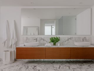 A bathroom with a marble countertop
