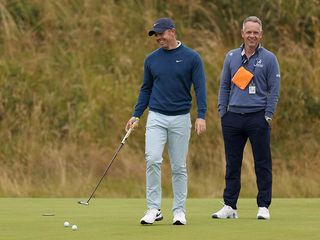 Rory McIlroy getting putting advice from Luke Donald at the Open Championship 2024 at Royal Troon