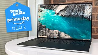 Dell XPS 15 laptop with a Tom's Guide deal tag