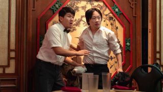 Ronny Cheng and Jimmy O. Yang (L-R) standing in a restaurant in Hulu&#039;s &quot;Interior Chinatown&quot;