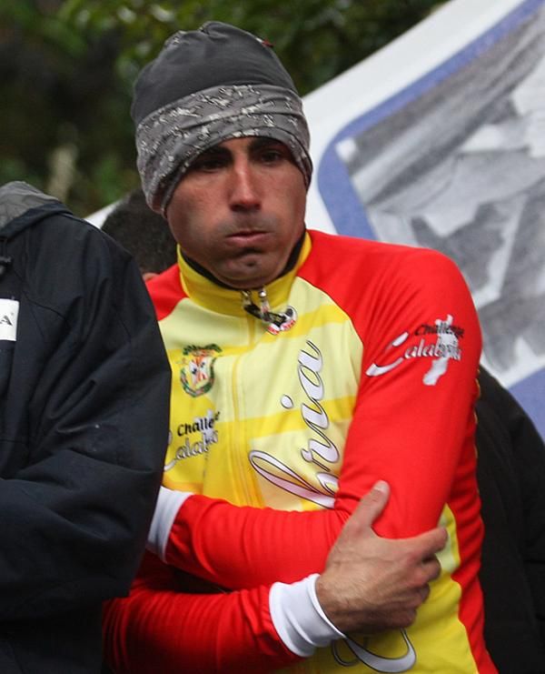 Francisco Ventoso tries to get warm after a cold stage.