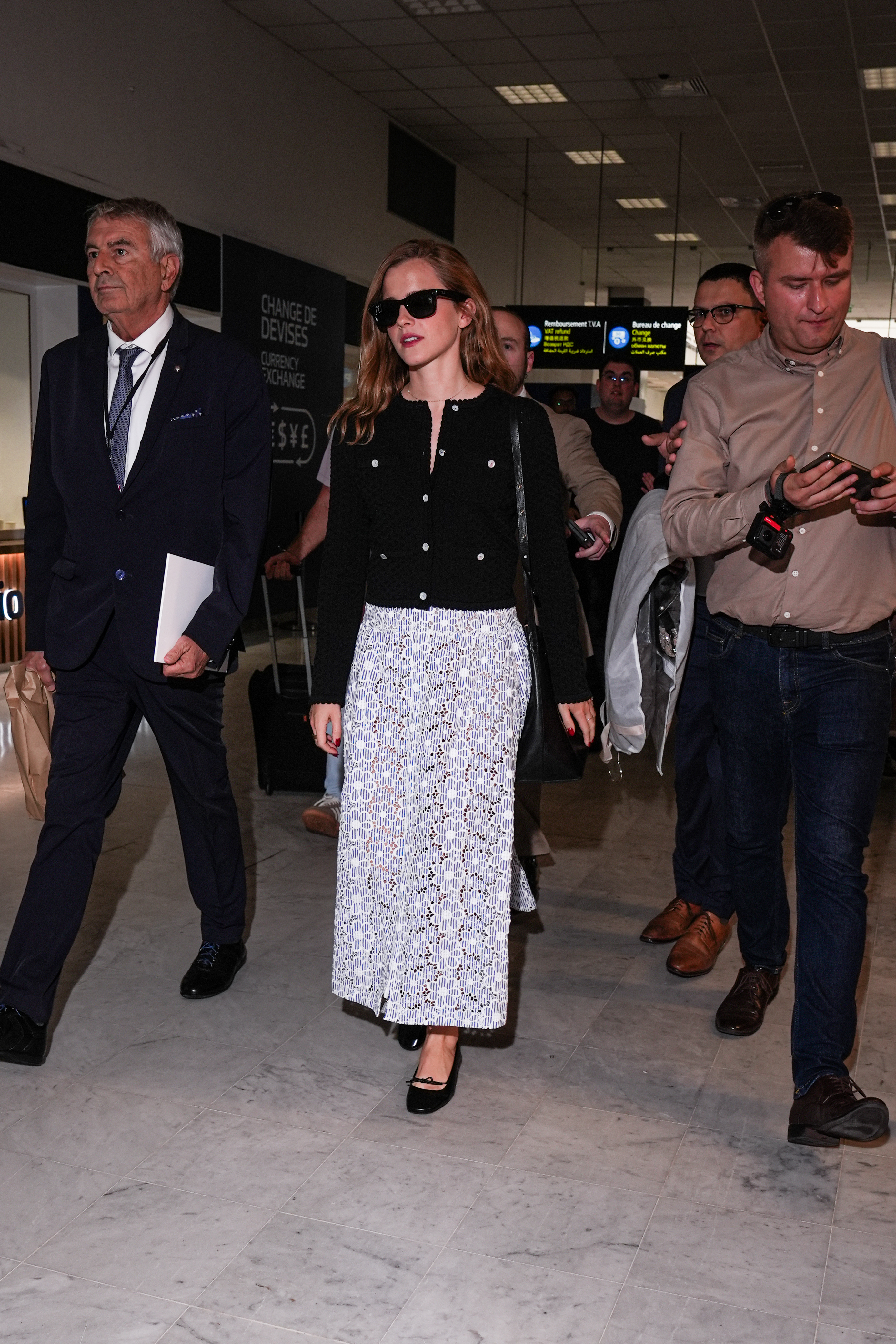 Emma Watson arrives at the 2025 Cannes Film Festival wearing a Chanel dress and ballet pumps