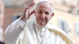Pope Francis waves to the pilgrims gathered in St. Peter's Square for the general audience on June 13, 2018 in Vatican City.