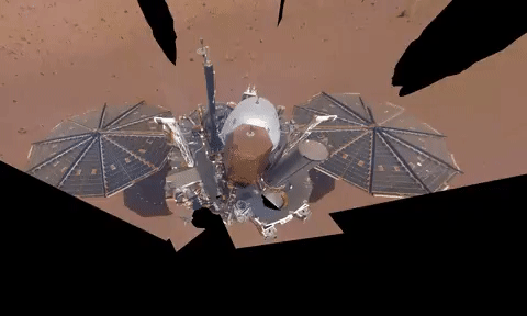 Time lapse image showing a spaceship with clean solar panels in one image and dusty solar panels in another