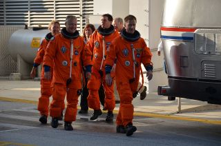 The four astronauts on shuttle Atlantis' final mission, the STS-135 flight, conducted a dress rehearsal for their July liftoff on June 23.