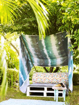 outdoor living room with fabric and a sofa