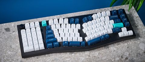 A black Keychron Q14 Max Alice keyboard with white, blue and teal keycaps