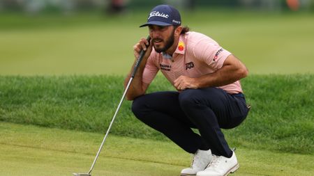 Max Homa lines up a putt on the second green during the Travelers Championship.