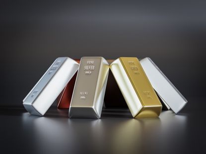 eight common precious metal bars arranged into prism on black background