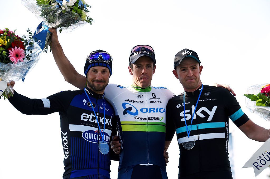 Winner Australias Mathew Hayman C secondplaced Belgiums Tom Boonen L and thirdplaced Great Britains Ian Stannard R celebrate on the podium at the end of the 114th edition of the ParisRoubaix oneday classic cycling race between Compiegne and Roubaix on April 10 2016 in Roubaix northern France AFP PHOTO FRANCOIS LO PRESTI AFP FRANCOIS LO PRESTI Photo credit should read FRANCOIS LO PRESTIAFP via Getty Images