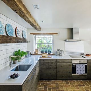 Kitchen with dark oak interiors and light accents