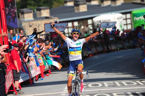 An ecstatic Alberto Contador has won the Vuelta's 17th stage and will don the red leader's jersey.