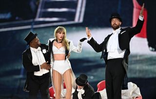 Taylor Swift is joined on stage by Travis Kelce during "Taylor Swift | The Eras Tour" at Wembley Stadium on June 23, 2024 in London, England.