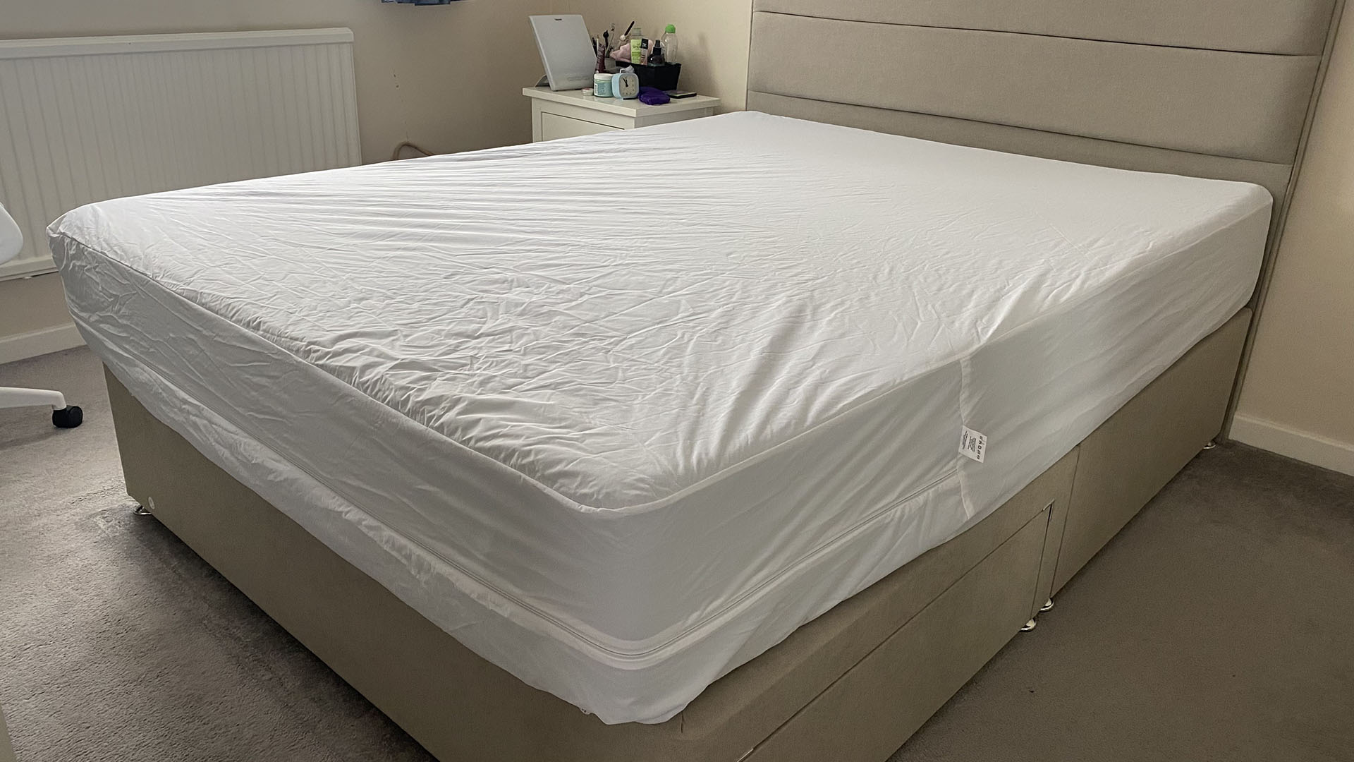 The Linenspa Mattress Encasement on a mattress in a bed frame in our reviewer Ruth Jones' bedroom