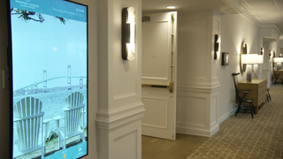 The Newport Harbor Island Resort lit up with digital signage. 