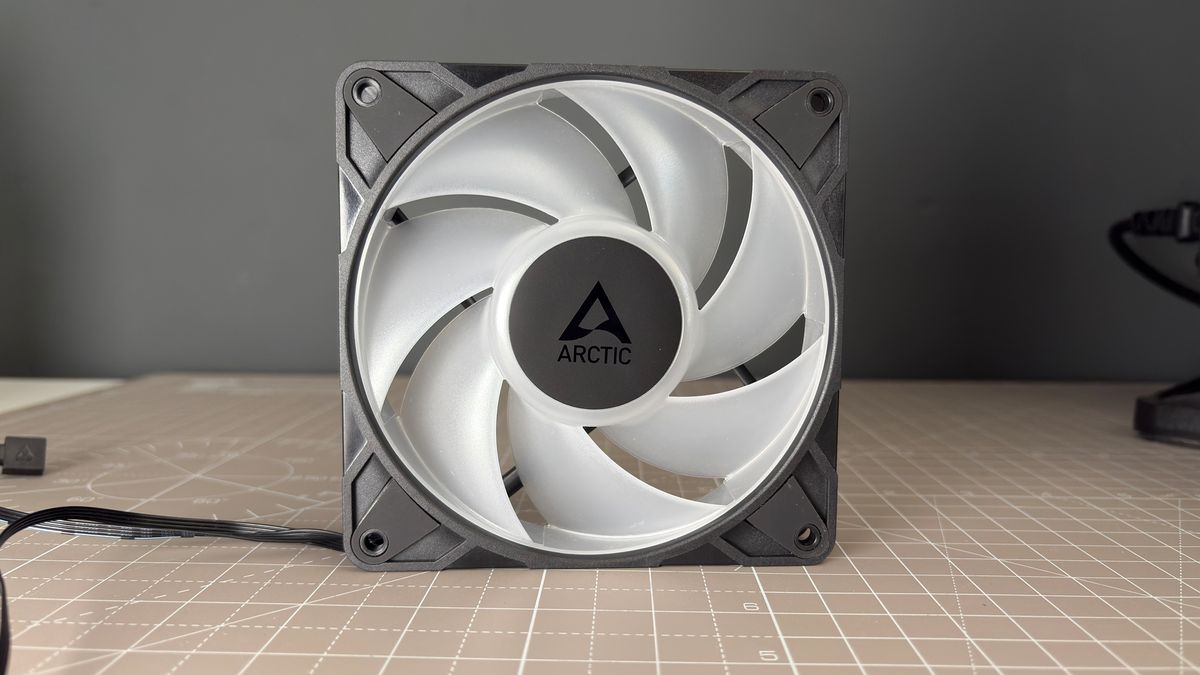 Various PC fans on a table with testing equipment for a round of batch tests.