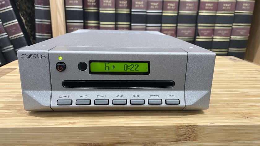 Cyrus CDi player on wooden rack with magazines in background