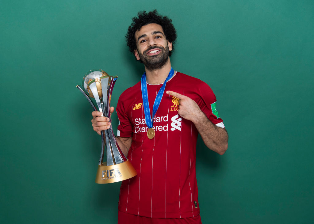 Mohamed Salah of Liverpool poses with the Club World Cup trophy after the FIFA Club World Cup Qatar 2019 Final between Liverpool and CR Flamengo at Khalifa International Stadium on December 21, 2019 in Doha, Qatar.