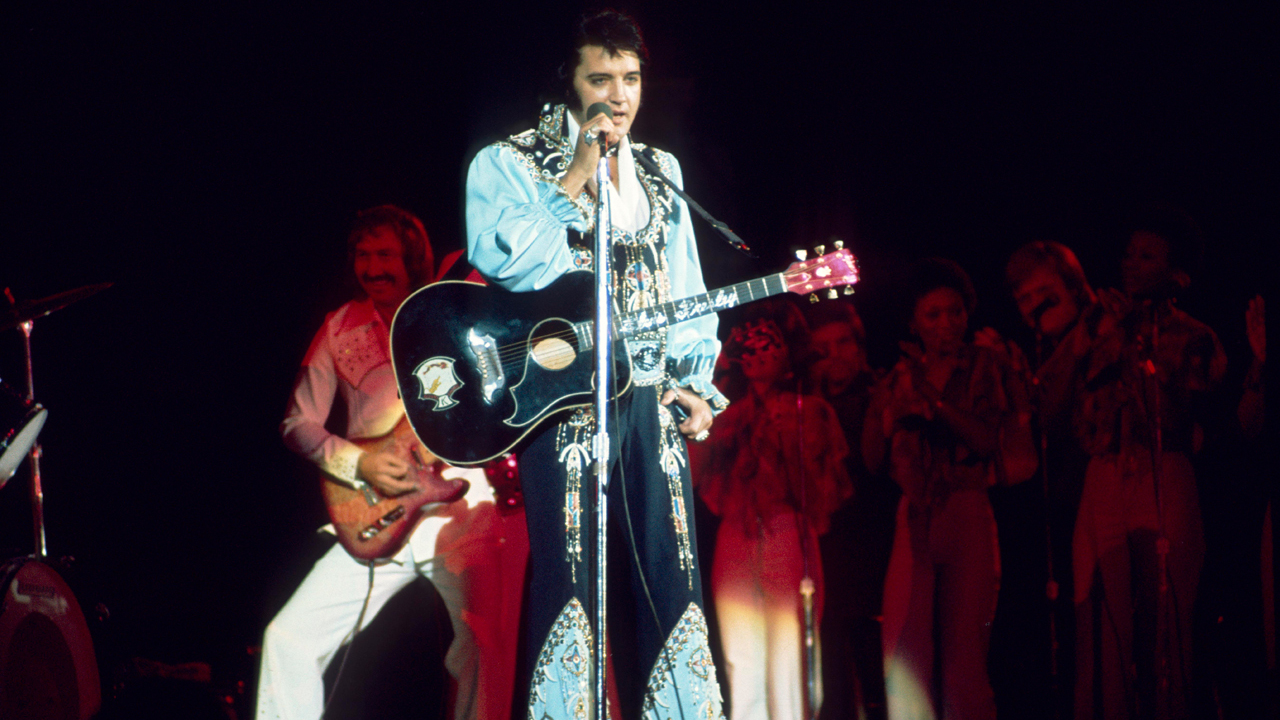 Elvis Presley with the Gibson Dove guitar