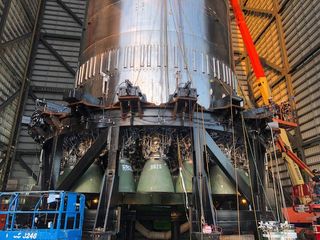 Elon Musk posted this photo of a SpaceX Super Heavy booster prototype, with its newly installed Raptor engines, on Twitter on Aug. 2, 2021. 