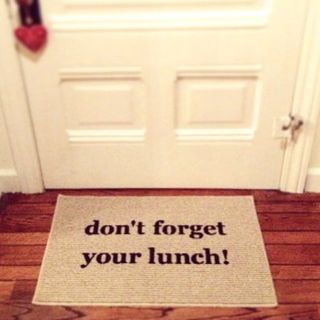 cream colour doormat on wooden floor with text dont forget your lunch