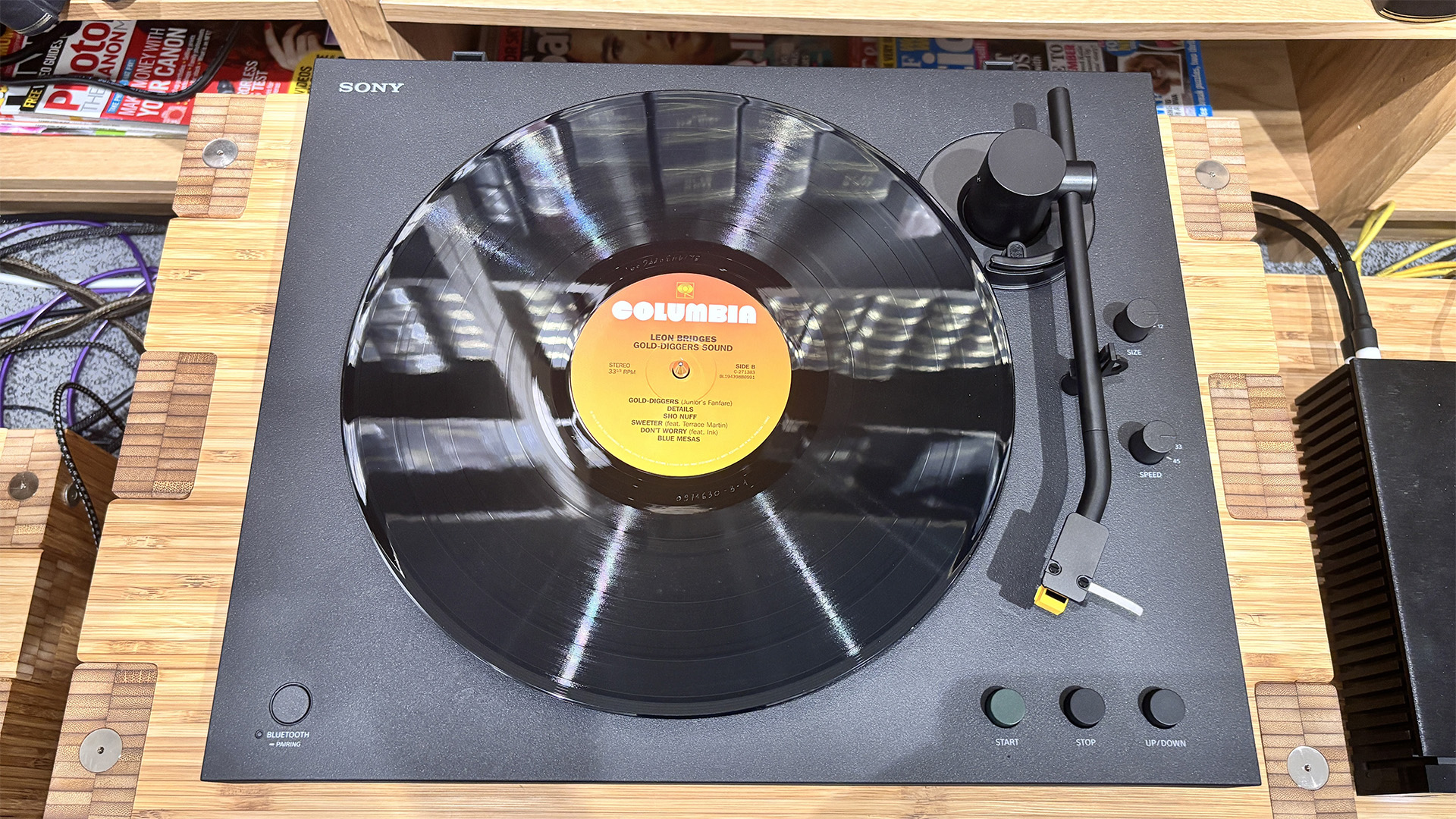 Sony PS-LX5BT Bluetooth turntable with black vinyl record on platter