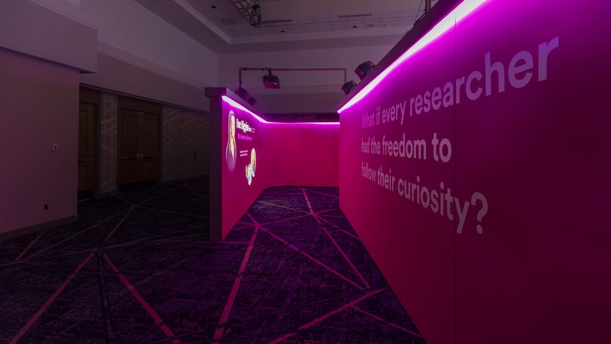 A wall alit in violet at an immersive installation for a nonprofit cancer organization donor event in Seattle.