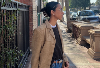 Stephanie Arant in a suede jacket, sweater, and jeans.