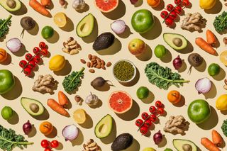 Pattern of variety fresh of organic fruits and vegetables and healthy vegan meal ingredients on beige background