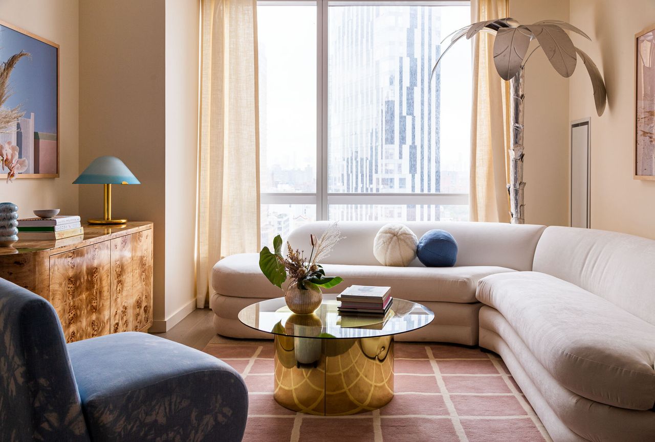 Pink and grey living room designed by White Arrow 