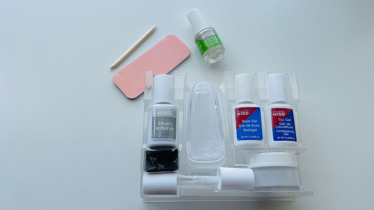 Kiss All Hail Dip Color System on a white table for the best dip powder nail kits.