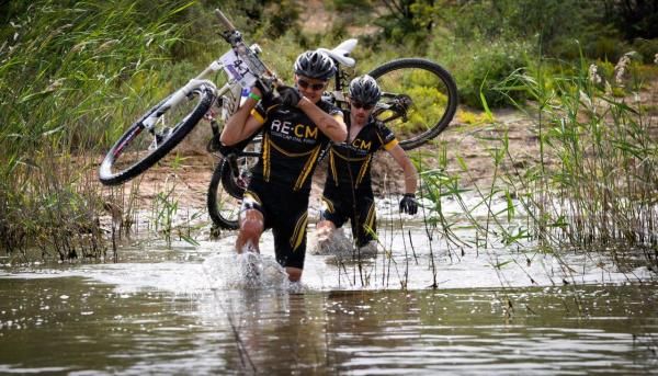 Racers slog through a water crossing