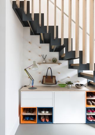 Under the stair storage using peg boards