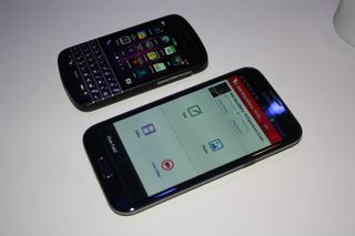 A BlackBerry Q10 compared to the Samsung Galaxy Note 2