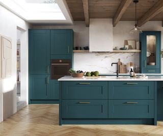 dark teal kitchen cabinets in kitchen with wooden floor, kitchen island, large rooflight, wooden beams and cladding on ceiling and opening into another room