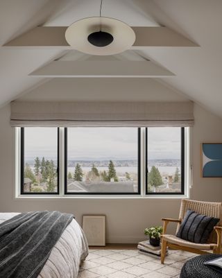 A bedroom with vaulted wooden ceilings